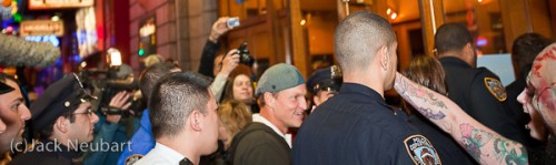 Celebrity sighting. Actor Woody Harrelson entering the movie theater for the premiere of his new flick Zombieland. I know, he's not exactly in focus, but I didn't have time to do more than raise the camera above the heads of the crowd and hope for the best. As it turns out, he's very amiable, to the point of shaking hands with fans. Copyright  ©2009 Jack Neubart. All rights reserved.