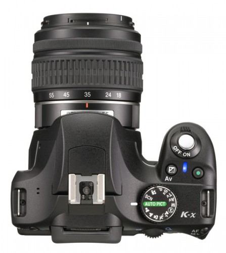 Pentax K-x Black Version--top. The camera features a comfy grip. Photo courtesy of Pentax.