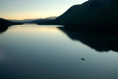 A small boat on Ealue Lake after sunset, Stikine Plateau, British Columbia © Paul Colangelo 2012