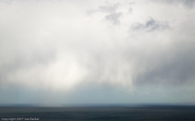 Virga over the Straits of Magellan: The sky was more interesting than the water, so I used a lot more sky than water.  Sometimes it's that simple.