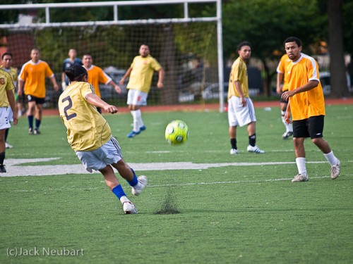 Getting your kicks. I realized too late that the camera was still in Program mode for this soccer shot, but that didn't seem to be seriously detrimental. If anything, the slight blur added to the momentum. Copyright  ©2009 Jack Neubart. All rights reserved.