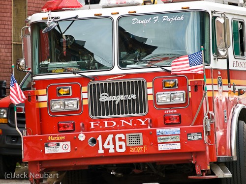 Fire engine. I photographed the fire engine from around a half block away, with the lens at 200mm, then moved in closer, setting the lens at 50mm, for this study of all the gauges and knobs (I just loved the arrangement of rectangular and circular shapes, with those color accents). Note the crisp detail in each case, and the rich colors. Copyright  ©2009 Jack Neubart. All rights reserved.