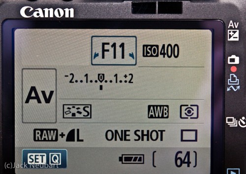 LCD monitor. Make the camera smaller and you have to maximize the available real estate, hence the lack of a top data panel. So now the LCD monitor takes over this function. Interestingly, put eye to the optical viewfinder and this display extinguishes until you pull away from the camera--nice touch (note the display-off sensor immediately above). Copyright  ©2009 Jack Neubart. All rights reserved.