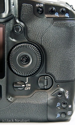 Canon EOS 1Ds Mark III - card door. The camera's card door has an inconvenient latch that makes accessing this compartment rather awkward. On the plus side, there are two slots: for SD and CF cards that work in tandem, so there's little fear of running out of card memory during a fast-paced and arduous shoot. Copyright  ©2009 Jack Neubart. All rights reserved.