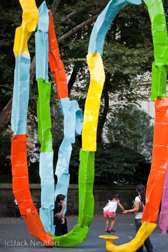 Sculpture, Central Park. When I saw this colorful and mystifying sculpture, I had to shoot it. Okay, in this instance, perhaps a wide-angle might have let me shoot from a closer distance (without standing in the street, in the way of traffic), but the short telephoto focal length kept perspective more natural. Interestingly, the f/2 exposure let me shoot at 1/100 sec (ISO 100), enough to suspend motion. Copyright  ©2009 Jack Neubart. All rights reserved.