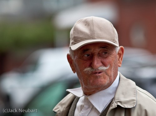 Candid portrait. As this distinguished-looking gentleman passed me on the street, I quickly snapped his picture, then asked him to pose for this shot, captured by available light (ISO 800: f/3.5, 1/400). Copyright  ©2009 Jack Neubart. All rights reserved.