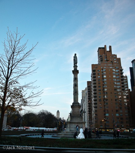   Statue of Columbus, Columbus Circle, NYC. When I was done photographing the buildings, I turned around to find a bridal party being photographed by the statue. While I was able to get some shots at a closer distance, I like this one, with the huge sculpture reflecting the enormity of the situation.  ©2009 Jack Neubart. All rights reserved.